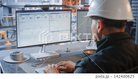 Industrial Specialist Monitoring Conveyor Robots from Factory Glass Office Industrial Specialist Monitoring Conveyor Robots from Factory Glass Office 142480625