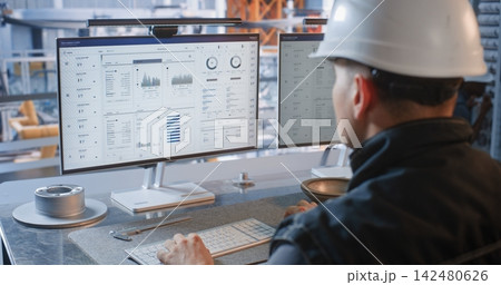 Industrial Specialist Monitoring Conveyor Robots from Factory Glass Office 142480626