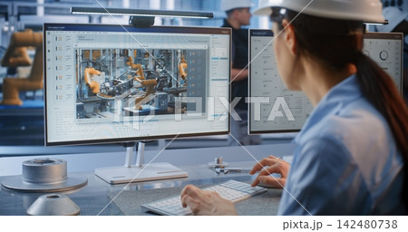 Female Specialist Monitoring Factory Data Analytics on PC Screen Female Specialist Monitoring Factory Data Analytics on PC Screen 142480738