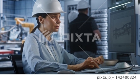Female Engineer Designing 3D Vehicle Chassis Model on Factory PC Screen Female Engineer Designing 3D Vehicle Chassis Model on Factory PC Screen 142480824
