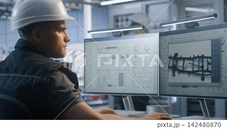 Industrial Specialist Supervising Factory Telemetry Data on Dual Monitors Industrial Specialist Supervising Factory Telemetry Data on Dual Monitors 142480870