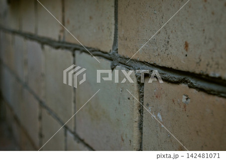 Weathered Concrete Block Wall with Horizontal Crack Weathered Concrete Block Wall with Horizontal Crack 142481071