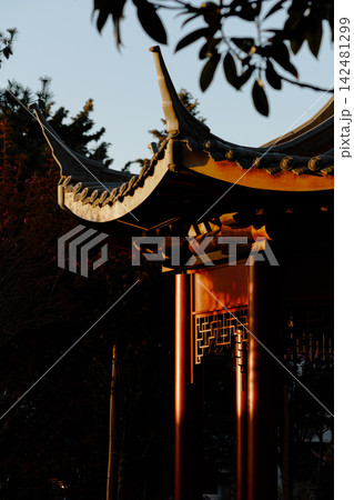 Traditional Asian Pavilion with Curved Roof at Sunset Traditional Asian Pavilion with Curved Roof at Sunset 142481299