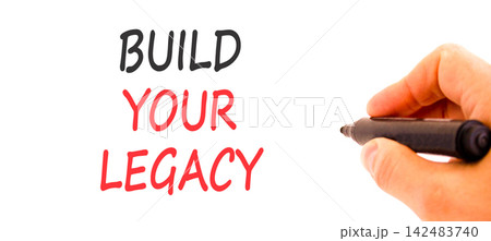 Build your legacy words symbol. Concept words Build your legacy on beautiful white paper. Beautiful white background. Businessman hand. Business build your legacy concept. Copy space. Build your legacy words symbol. Concept words Build your legacy on beautiful white paper. Beautiful white background. Businessman hand. Business build your legacy concept. Copy space. 142483740