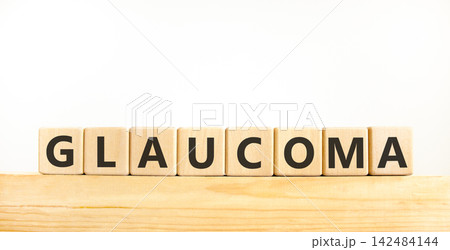 Glaucoma word symbol. Concept word Glaucoma on beautiful wooden blocks on wooden beam. Beautiful white background. Medical support help glaucoma word concept. Copy space. 142484144