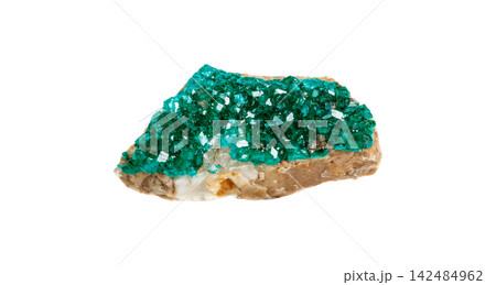 Stunning green mineral stone specimen emerald-green dioptase crystal formations, isolated 142484962