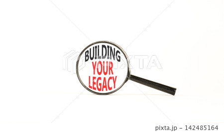 Building your legacy words symbol. Concept words Building your legacy in beautiful magnifying glass. Beautiful white background. Business building your legacy concept. Copy space. 142485164