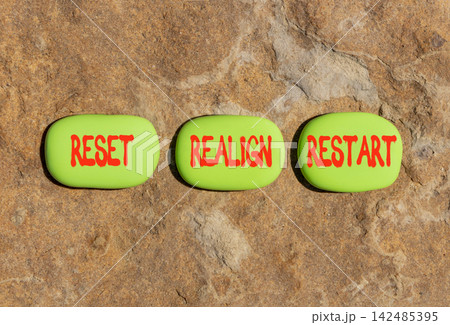 Reset realign restart words symbol. Concept words Reset realign restart on beautiful green stones. Beautiful stone background. Business motivational and reset realign restart concept. Copy space. Reset realign restart words symbol. Concept words Reset realign restart on beautiful green stones. Beautiful stone background. Business motivational and reset realign restart concept. Copy space. 142485395