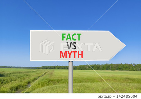 Fact vs versus myth words symbol. Concept words Fact vs Myth on beautiful grey road sign. Beautiful blue sky green grass background. Business and fact vs versus myth concept. Copy space. Fact vs versus myth words symbol. Concept words Fact vs Myth on beautiful grey road sign. Beautiful blue sky green grass background. Business and fact vs versus myth concept. Copy space. 142485604