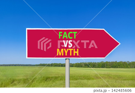 Fact vs versus myth words symbol. Concept words Fact vs Myth on beautiful red road sign. Beautiful blue sky green grass background. Business and fact vs versus myth concept. Copy space. Fact vs versus myth words symbol. Concept words Fact vs Myth on beautiful red road sign. Beautiful blue sky green grass background. Business and fact vs versus myth concept. Copy space. 142485606