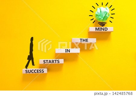 Success starts in the mind symbol. Concept words Success starts in the mind on beautiful wooden blocks. Beautiful yellow background. Business and success starts in the mind concept. Copy space. Success starts in the mind symbol. Concept words Success starts in the mind on beautiful wooden blocks. Beautiful yellow background. Business and success starts in the mind concept. Copy space. 142485768