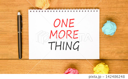 One more thing words symbol. Concept words One more thing on beautiful white note. Beautiful wooden background. Colored paper. Business and one more thing concept. Copy space. One more thing words symbol. Concept words One more thing on beautiful white note. Beautiful wooden background. Colored paper. Business and one more thing concept. Copy space. 142486248