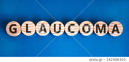 Glaucoma word symbol. Concept word Glaucoma on beautiful wooden circles. Beautiful blue background. Medical support help glaucoma word concept. Copy space. Glaucoma word symbol. Concept word Glaucoma on beautiful wooden circles. Beautiful blue background. Medical support help glaucoma word concept. Copy space. 142486303