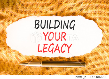 Building your legacy words symbol. Concept words Building your legacy on beautiful white paper. Beautiful canvas background. Black pen. Business building your legacy concept. Copy space. Building your legacy words symbol. Concept words Building your legacy on beautiful white paper. Beautiful canvas background. Black pen. Business building your legacy concept. Copy space. 142486688