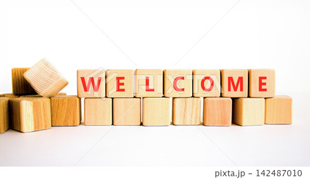 Welcome word symbol. Concept word Welcome on beautiful wooden blocks. Beautiful white table white background. Business welcome word concept. Copy space. Welcome word symbol. Concept word Welcome on beautiful wooden blocks. Beautiful white table white background. Business welcome word concept. Copy space. 142487010