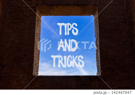 Tips and tricks words symbol. Concept words Tips and tricks on beautiful window. Beautiful blue sky background. Business tips and tricks motivational support concept. Copy space. Tips and tricks words symbol. Concept words Tips and tricks on beautiful window. Beautiful blue sky background. Business tips and tricks motivational support concept. Copy space. 142487047