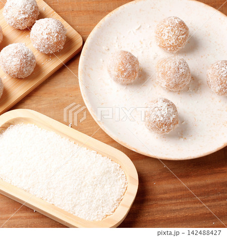 Homemade coconut beijinho a traditional Brazilian sweet prepared for birthday parties, weddings, and special celebrations. Homemade coconut beijinho a traditional Brazilian sweet prepared for birthday parties, weddings, and special celebrations. 142488427