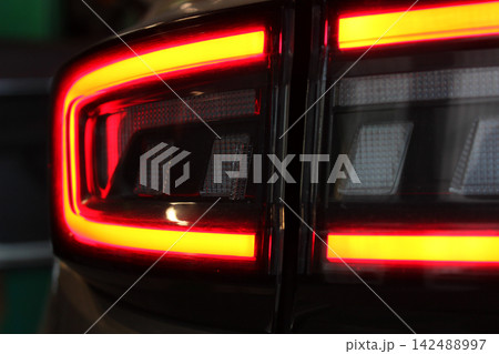Bright Red LED Elements Of Tail Lights In Car Backlight. Light Types Of Modern Vehicle In Action Bright Red LED Elements Of Tail Lights In Car Backlight. Light Types Of Modern Vehicle In Action 142488997