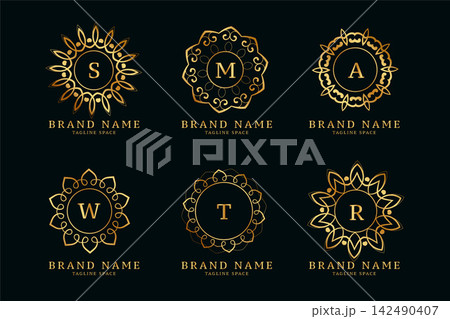 decorative golden mandala style logos with initials set 142490407