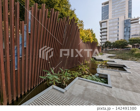 Portland, Oregon, USA - September 6, 2024: reclaimed railroad rail Artwall at Tanner Springs Park 142491380