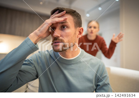 Frustrated man tired with woman partner conflict escalation, married couple in disagreement crisis Frustrated man tired with woman partner conflict escalation, married couple in disagreement crisis 142491634