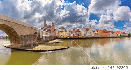 Stone Bridge and Danube River Waterfront in Regensburg, Germany Stone Bridge and Danube River Waterfront in Regensburg, Germany 142492266