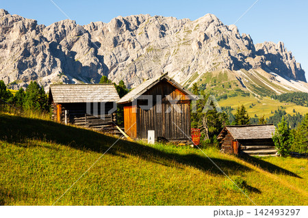 Countryside view of Dolomites mountains. Houses in mountains against Munt de Fornella, South Tyrol, Italy 142493297