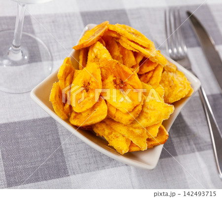 There is appetizer for low alcohol beverage - fried plantains chips There is appetizer for low alcohol beverage - fried plantains chips 142493715