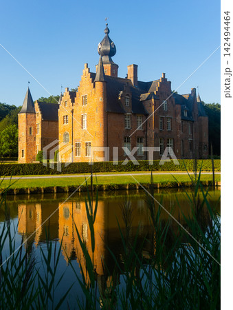 Summer view of Rumbeke Castle near pond in landscaped park, Belgium Summer view of Rumbeke Castle near pond in landscaped park, Belgium 142494464
