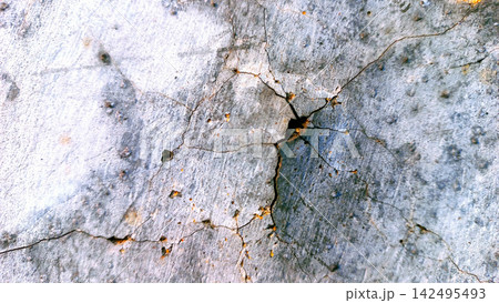 Cracked and Weathered Concrete Surface with Pitting 142495493