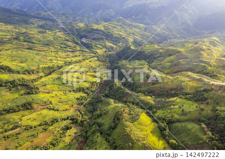 Landscape of Morning Mist with Mountain Layer. mountain ridge and clouds in rural jungle bush forest 142497222
