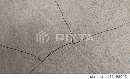 Cracks on the weathered concrete surface. Cracks on the weathered concrete surface. 142498948