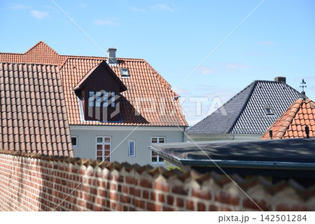 Old brick houses in traditional style in the center of the old town Old brick houses in traditional style in the center of the old town 142501284