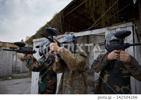 Group of soldiers preparing for the attack together, while aiming, using their weapons Group of soldiers preparing for the attack together, while aiming, using their weapons 142504266
