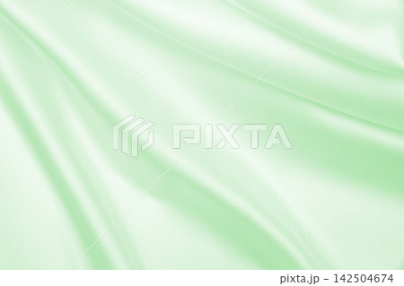 Smooth elegant green silk or satin luxury cloth texture as abstract background. Luxurious background design Smooth elegant green silk or satin luxury cloth texture as abstract background. Luxurious background design 142504674