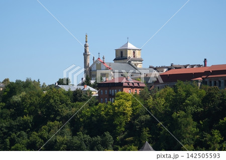 Historic Old Town Skyline of Kamianets Podilskyi with Saints Peter and Paul Cathedral and Minaret Rising Above Green Smotrych Canyon in Ukraine Historic Old Town Skyline of Kamianets Podilskyi with Saints Peter and Paul Cathedral and Minaret Rising Above Green Smotrych Canyon in Ukraine 142505593