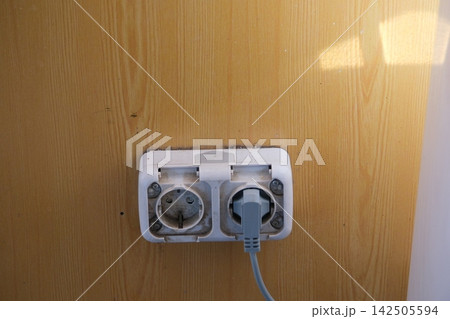 Dirty Electrical Wall Socket with Black Grime Dust and Stains Around Plug Showing Neglected Outlet and Poor Household Cleaning Dirty Electrical Wall Socket with Black Grime Dust and Stains Around Plug Showing Neglected Outlet and Poor Household Cleaning 142505594
