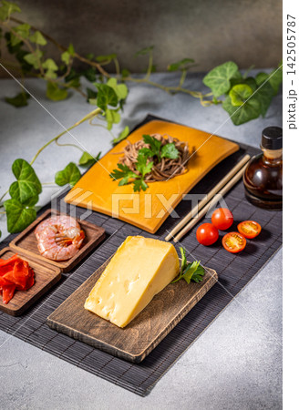 Soba noodles, cheese, shrimp and cherry tomatoes creating a fusion cuisine delight Soba noodles, cheese, shrimp and cherry tomatoes creating a fusion cuisine delight 142505787
