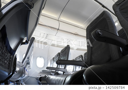 Empty airplane cabin without passengers Empty airplane cabin without passengers 142509784