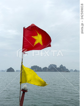 Vietnamese flag and yellow signal flag on cruise boat Vietnamese flag and yellow signal flag on cruise boat 142509818