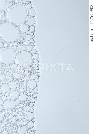 The texture of the foam of shower gel or soap suds or shaving foam. Macrophotography. Copy space The texture of the foam of shower gel or soap suds or shaving foam. Macrophotography. Copy space 142509902