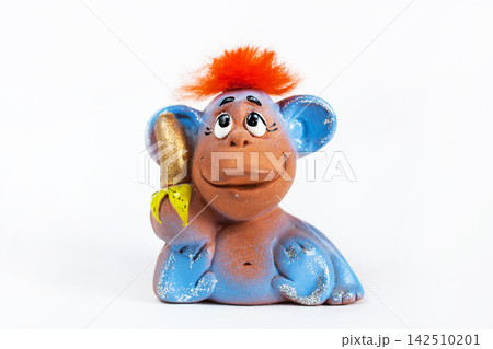 Red hair monkey with banana on white background Red hair monkey with banana on white background 142510201