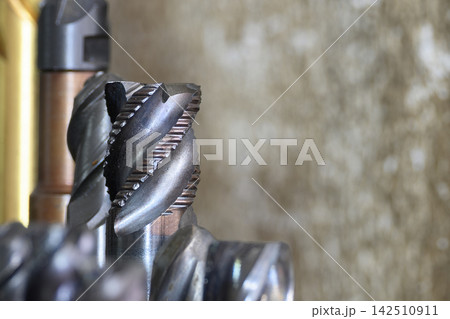 Close up of a worn solid end mill wave edge rough cutter for CNC milling 142510911