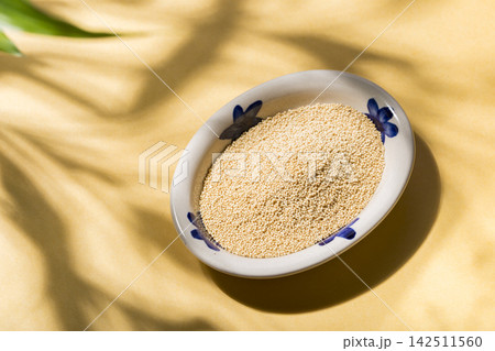 nutritious amaranth grains on a yellow background, top view nutritious amaranth grains on a yellow background, top view 142511560