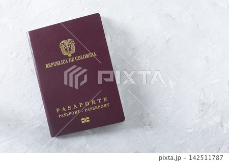passport of colombia seen from above, on white background passport of colombia seen from above, on white background 142511787