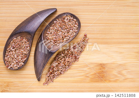 Linseed grains on the table- Linum usitatissimum Linseed grains on the table- Linum usitatissimum 142511808