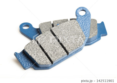Motorcycle brake pads isolated on white background, close-up image 142511901