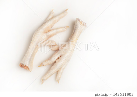 Chicken feet on white background 142511903
