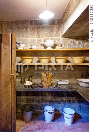 Historic Castle Dairy Room with Antique Ice Cream Churn 142512386