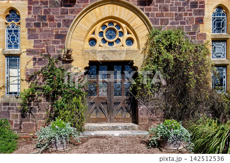 Gothic Revival Entrance and Ornate Stone Archway at Knightshayes Court Gothic Revival Entrance and Ornate Stone Archway at Knightshayes Court 142512536
